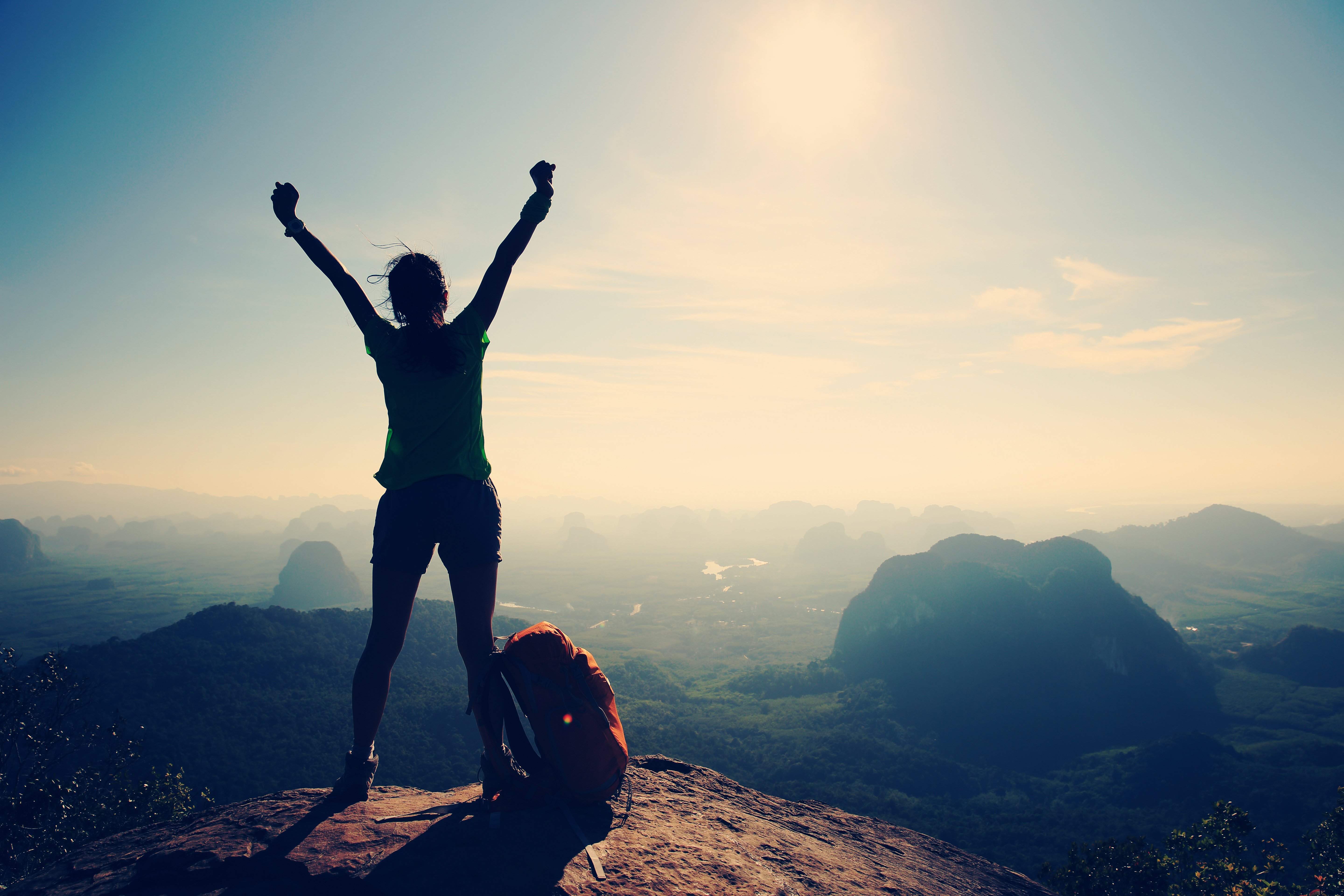 woman standing on mountain